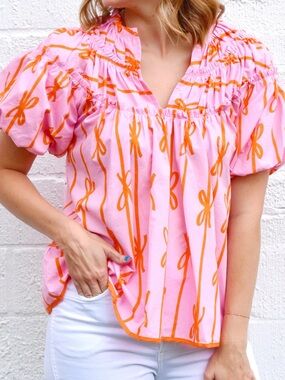 Umgee Pink Top with Orange Bow-Print Puff Sleeves